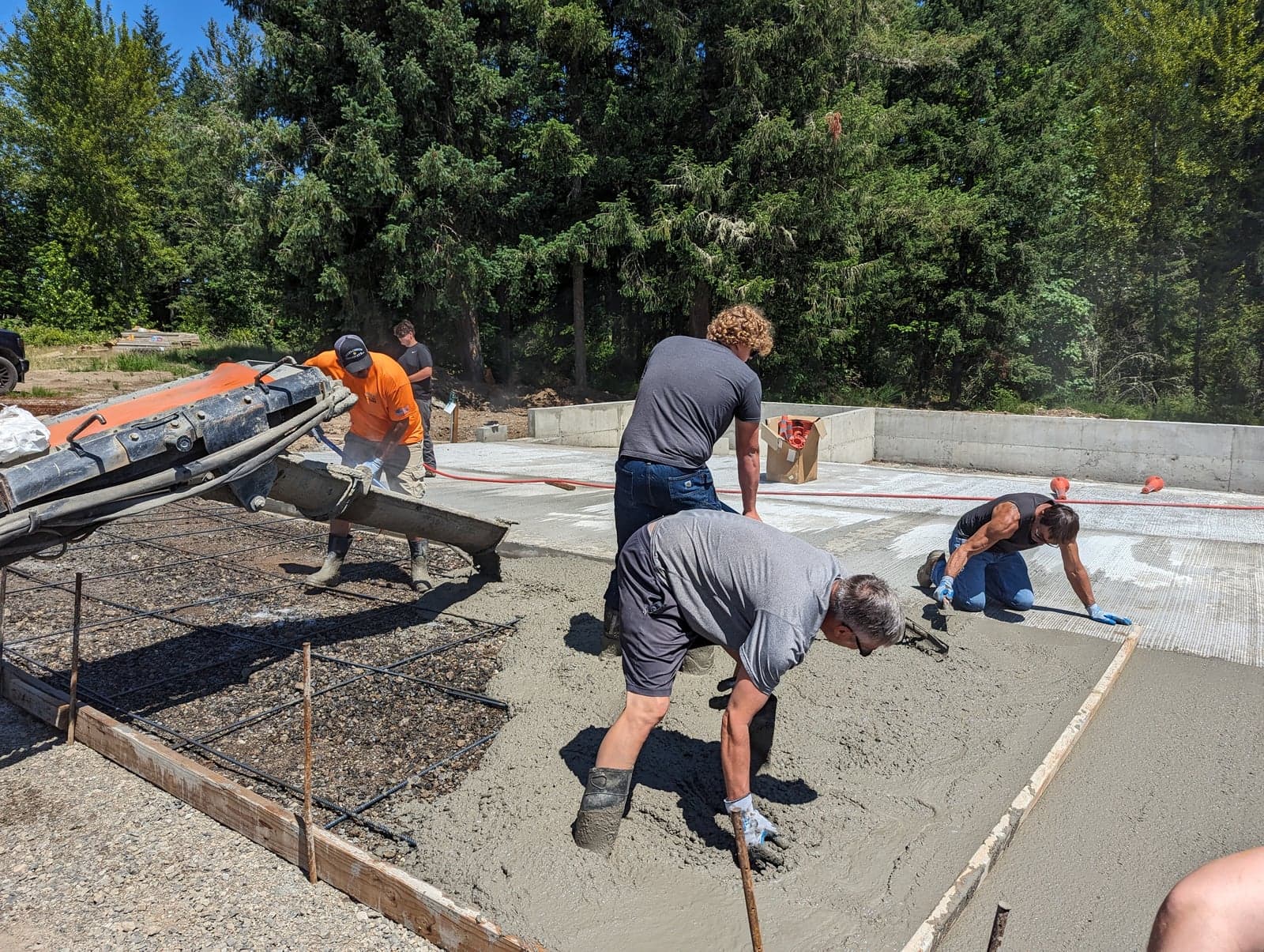 Chute pour into rebar forms on a sunny slab